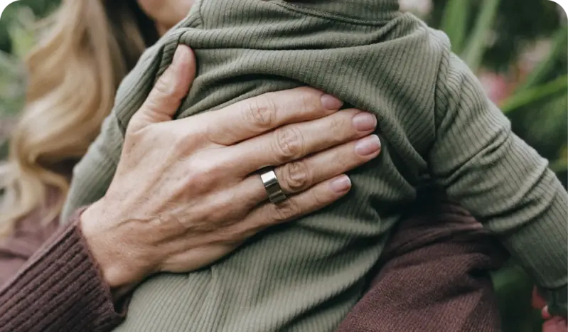 woman with alterme ring holding baby